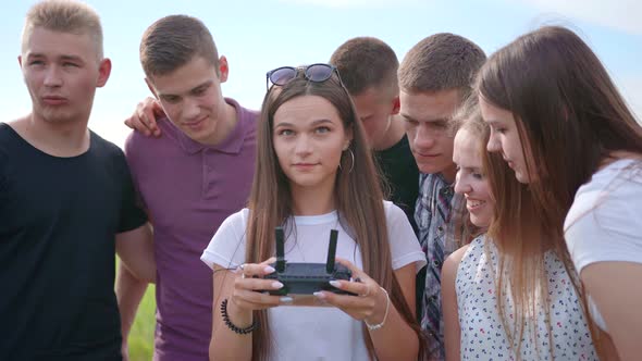 Cheerful Friends Control the Drone Using the Remote Control