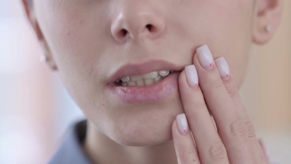 Face Close Up of Latin Women Having Toothache Cavity