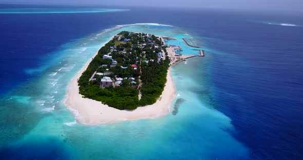 Tropical birds eye copy space shot of a sunshine white sandy paradise beach and aqua blue ocean back