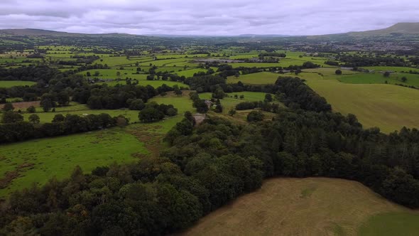 Reveal drone shot of rolling countryside landscape