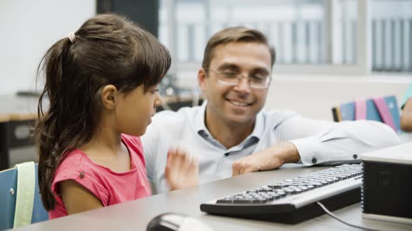 Hispanic Girl Enjoying Her First Lesson in Computer Scienece