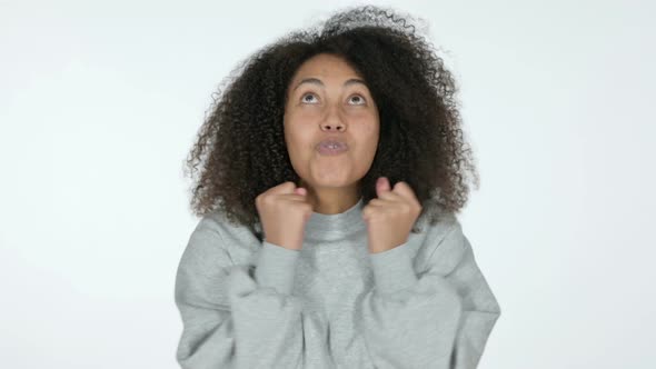 Excited African Woman Celebrating, White Background 