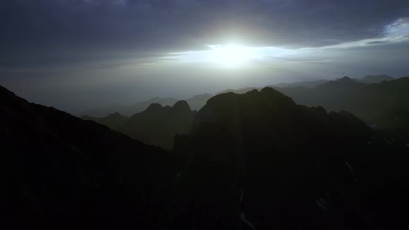 Beautiful Sunrise Over Wild Forest Mountains in Summer Morning