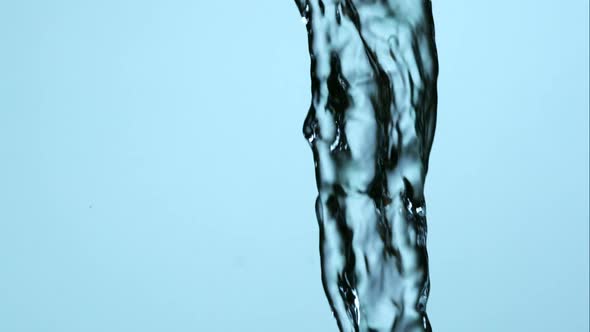 Water pouring and splashing in ultra slow motion 