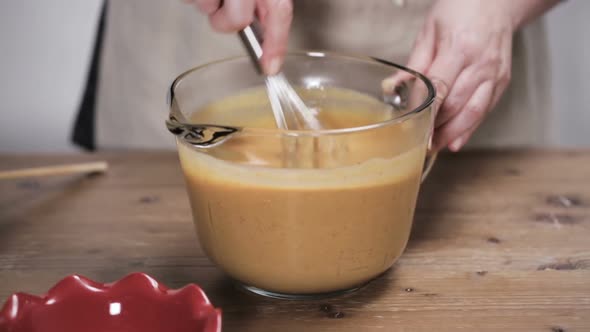 Step by step. Mixing ingredients for pumpkin pie filling.