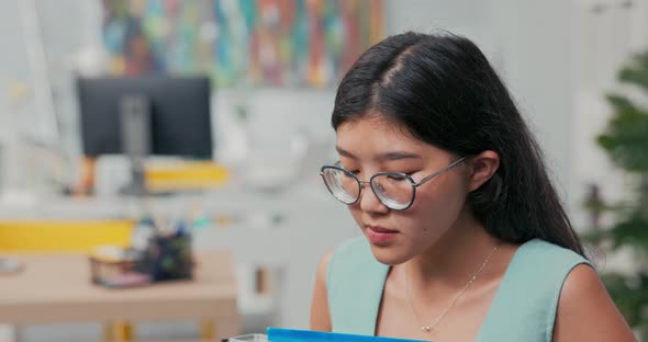 Sad Disillusioned Disappointed Young Woman with Glasses with Sorrow Leaves Her Job in the Company