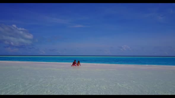 Young couple happy together on paradise lagoon beach journey by blue sea with white sand background 