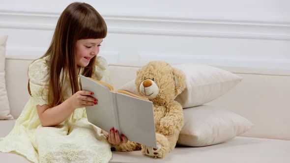 Girl with Teddy Bear Reading a Book
