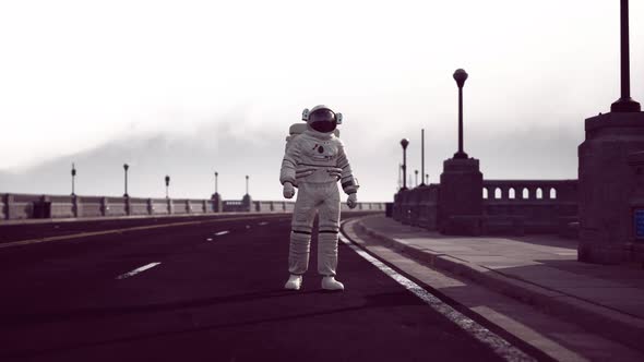 Astronaut Walks in the Middle of a Road alt