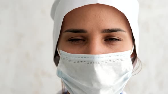 A Nurse with a Mask During a Coronavirus Pandemic, Close in Slow Motion