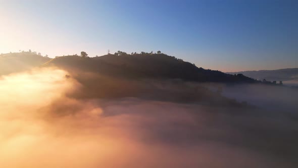 4K Aerial view of Mountains landscape with morning fog.