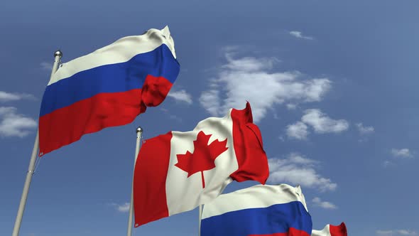 Row of Waving Flags of Canada and Russia alt