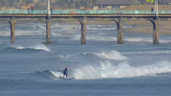 The Manhattan Beach Pier stands majestic over the Pacific Ocean.