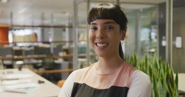 Portrait of happy caucasian businesswoman in empty office