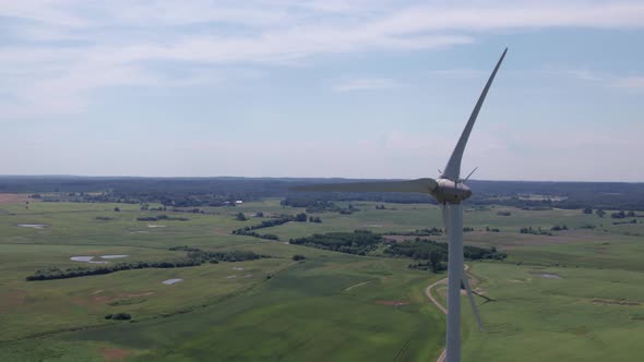 Aerial view of windmills farm for energy production on beautiful cloudy sky at highland. Wind power 