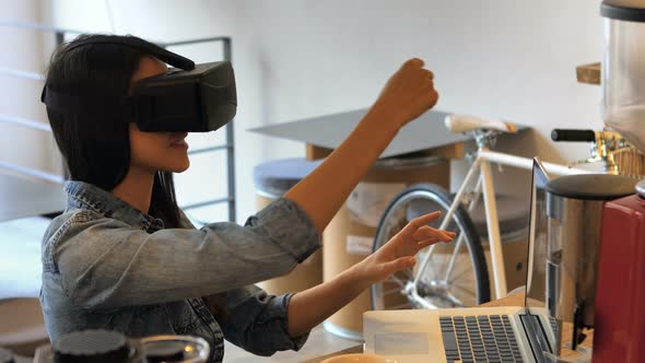 Female business executive using virtual glasses