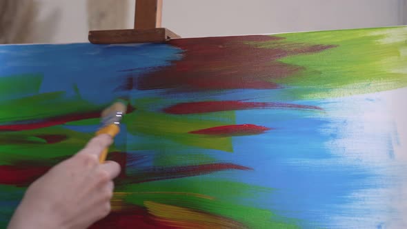 A Talented Contemporary Artistinnovator Paints an Abstract Painting on Canvas