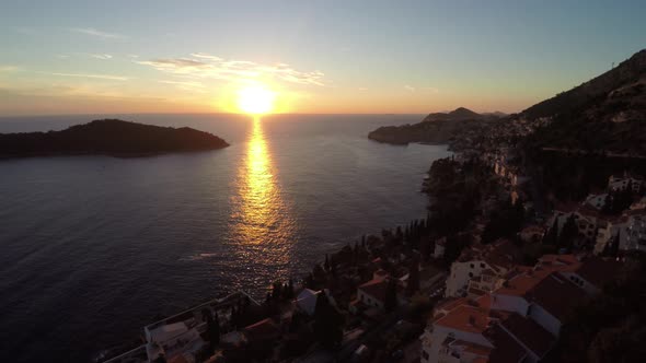 Aerial shot of the coast and Lokrum Island at sunset