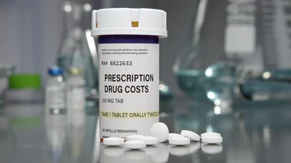 Prescription drug cost bottle and pills in medical lab
