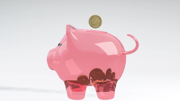 Coins Fall Into a Pink Glass Piggy Bank - a Symbol of Wealth, Frugality and Effective Investment