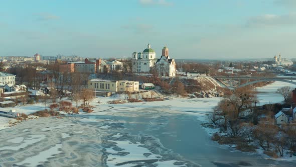 Beautiful winter flight over the city, Top view of the river that freezes, Ice