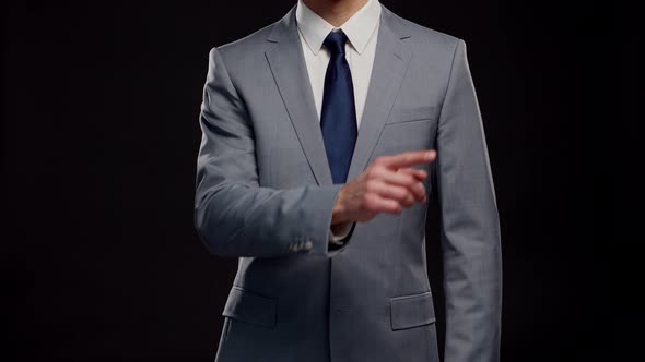Studio portrait of successful and smart businessman in suit and tie.