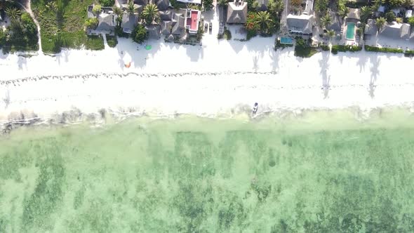 Vertical Video Boats in the Ocean Near the Coast of Zanzibar Tanzania Aerial View