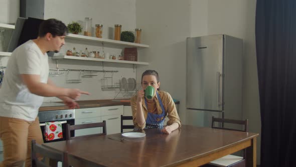 Married Couple Arguing During Breakfast at Home