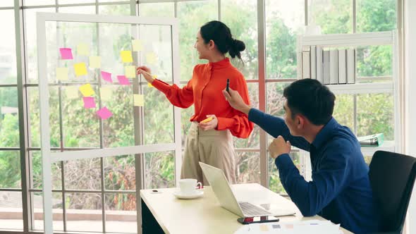 Business People Work on Project Planning Board