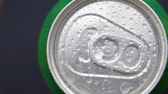 Top View Spinning  an Aluminum Can with a Chilled Beer or Other Beverage Covered with Water Droplets