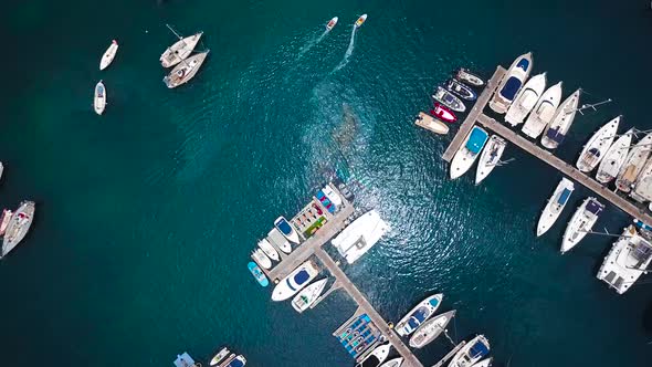 Flight Over a Dock with a Lot of Yachts and Boats  Shooting From a Drone