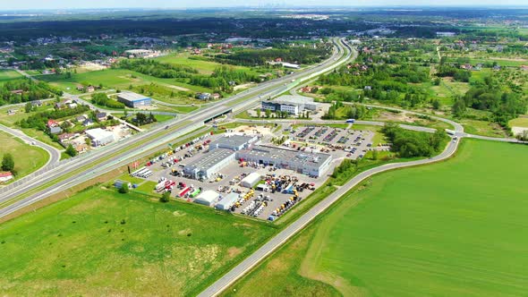 Aerial top down view of the big logistics park with warehouses, loading hub and a lot of semi trucks