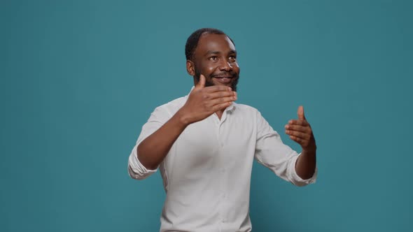 African American Man Showing Robot Dance Moves in Studio