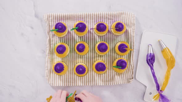 Flat lay. Step by step. Frosting vanilla cupcakes with Italian buttercream icing for Mardi Gras cele