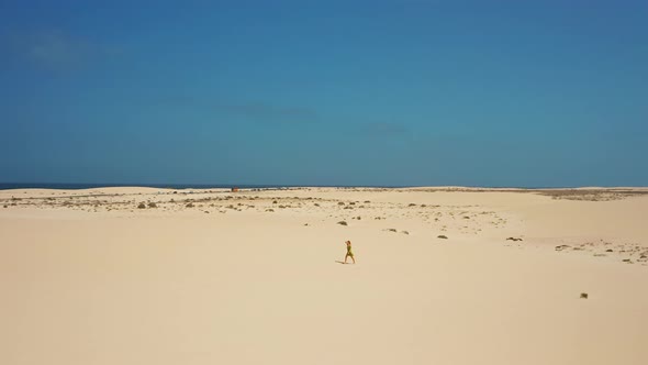 Aerial Flight Over White Sand Dunes in the Desert
