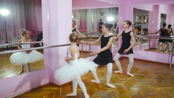 Three Young and Graceful Ballerinas Practicing Their Dance. They Wear Black Tutus