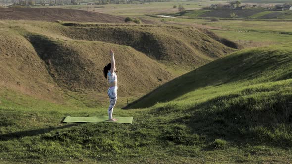 Woman Practicing Yoga in Nature