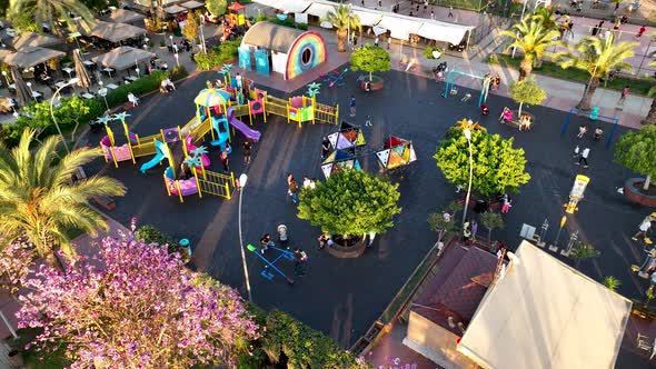 Children Play on the big playground Aerial View 4 K