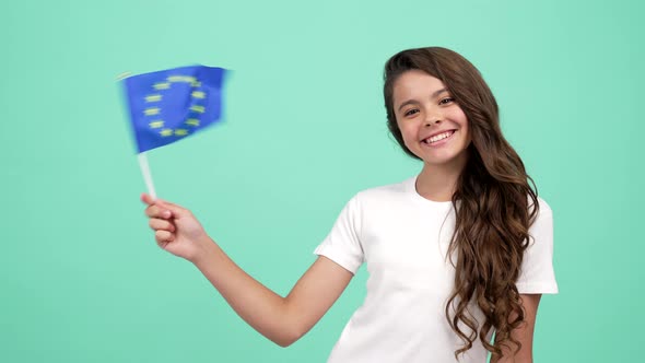 Kid with Cheerful Face Waving European Union Blue Flag Studying Abroad