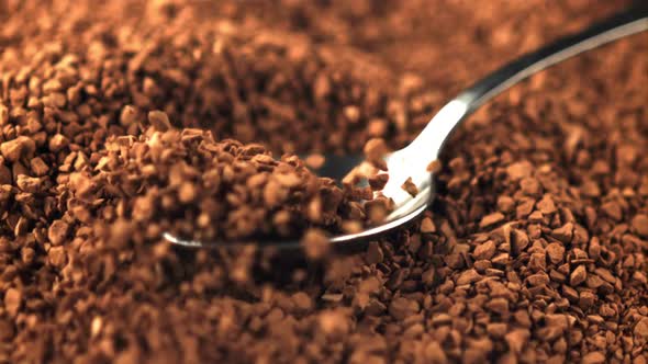 Super Slow Motion Spoon with Soluble Coffee Falls Into a Pile of Coffee