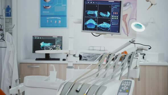 Closeup Revealing Shot of Medical Orthodontic Display with Teeth Xray Images on It