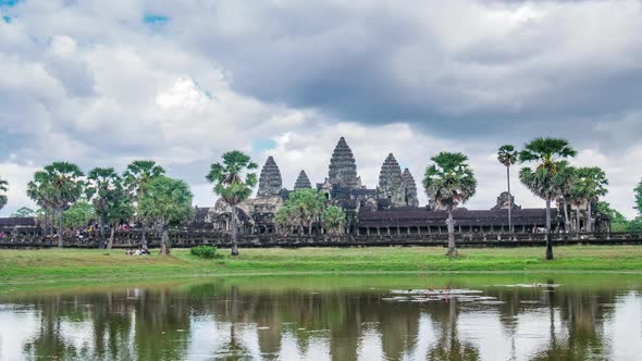 Daytime time lapse at Angkor Wat main facade reflection on water pond, Cambodia