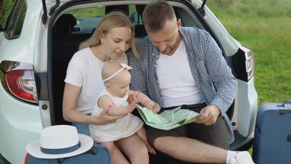 Happy Family Traveling By Car