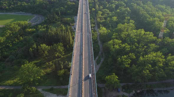 Aerial View of a Bridge Over a Large River with Heavy Traffic