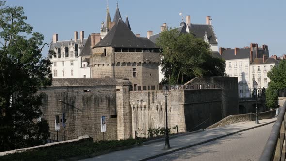 NANTES, FRANCE - JULY 2016 Entrance of Dukes of Brittany castle by the day with architecture and pub