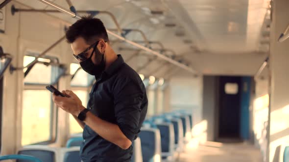 Man In Face Mask Protection Epidemic Coronavirus On Public Transport. Man In Face Mask On Tram.