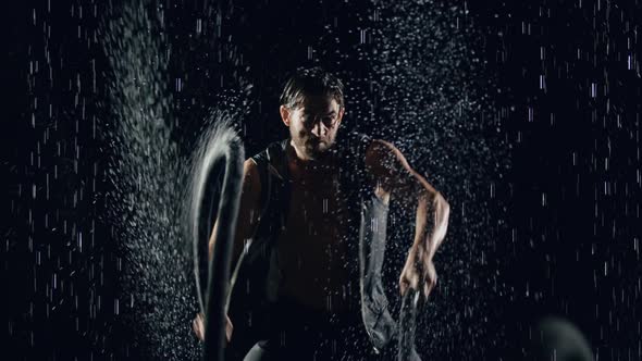 Athletic Man Working Out In The Rain