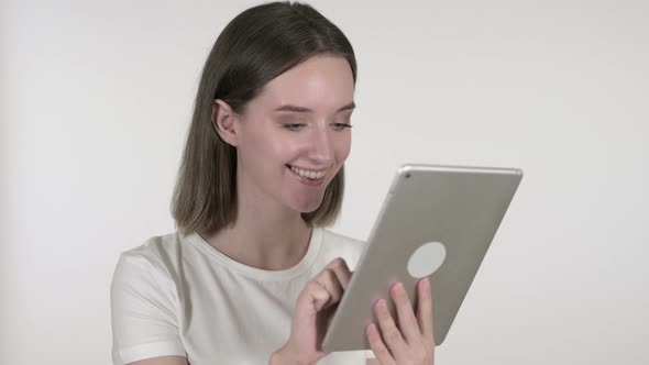 Young Woman Browsing Internet on Tablet, White Background