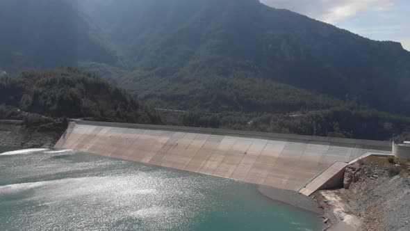 Mountain dam with calm turquoise water