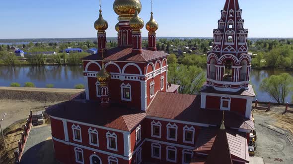 Beautiful Church By the River at Sunset on the Background of the Flooded City